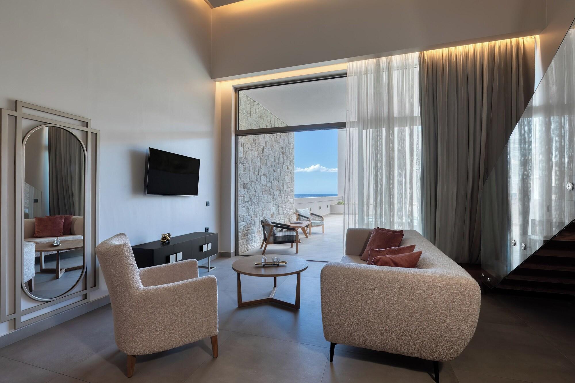 Suite met zithoek — Castello Boutique Suites by the Sea