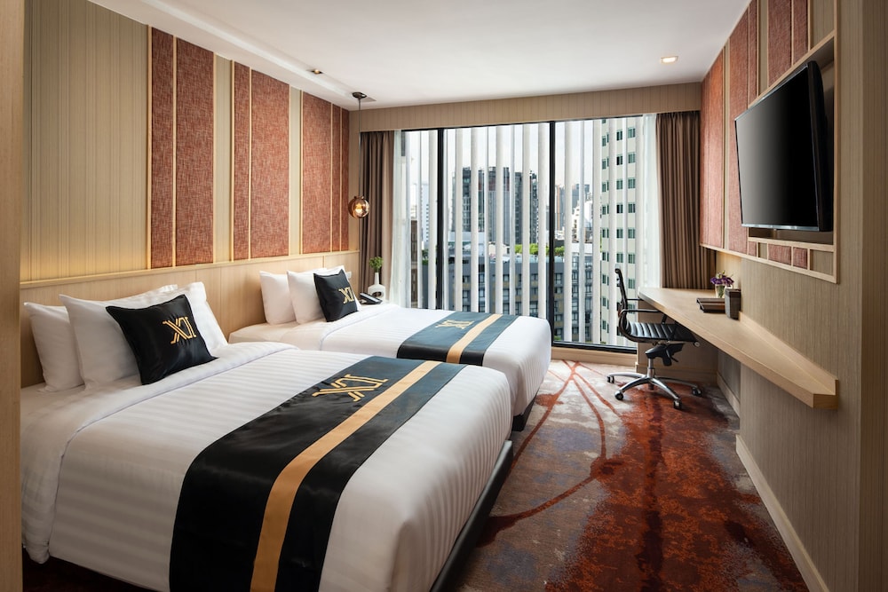 Slaapkamer Eleven Hotel Bangkok Sukhumvit 11 met kingsize bed