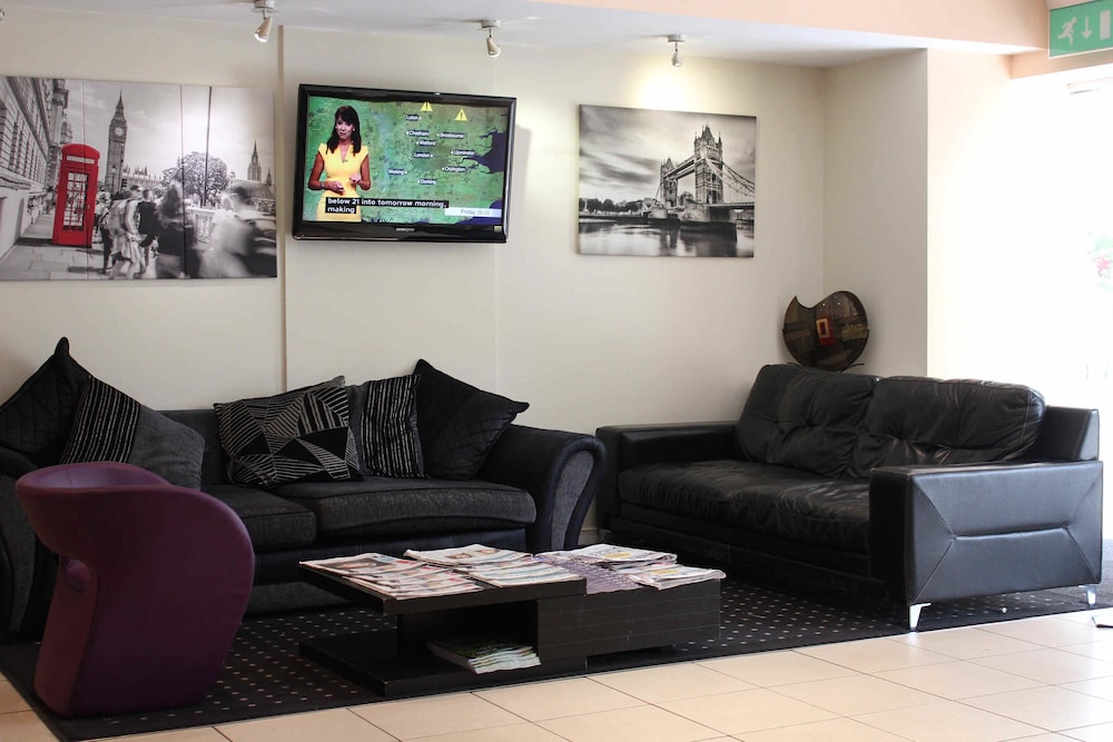 Comfortabele zitplaatsen lobbyruimte Grand Plaza Serviced Apartments