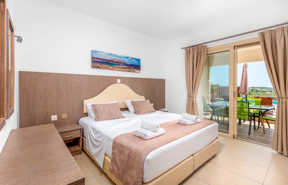 Slaapkamer met bed in Kolymbia Village