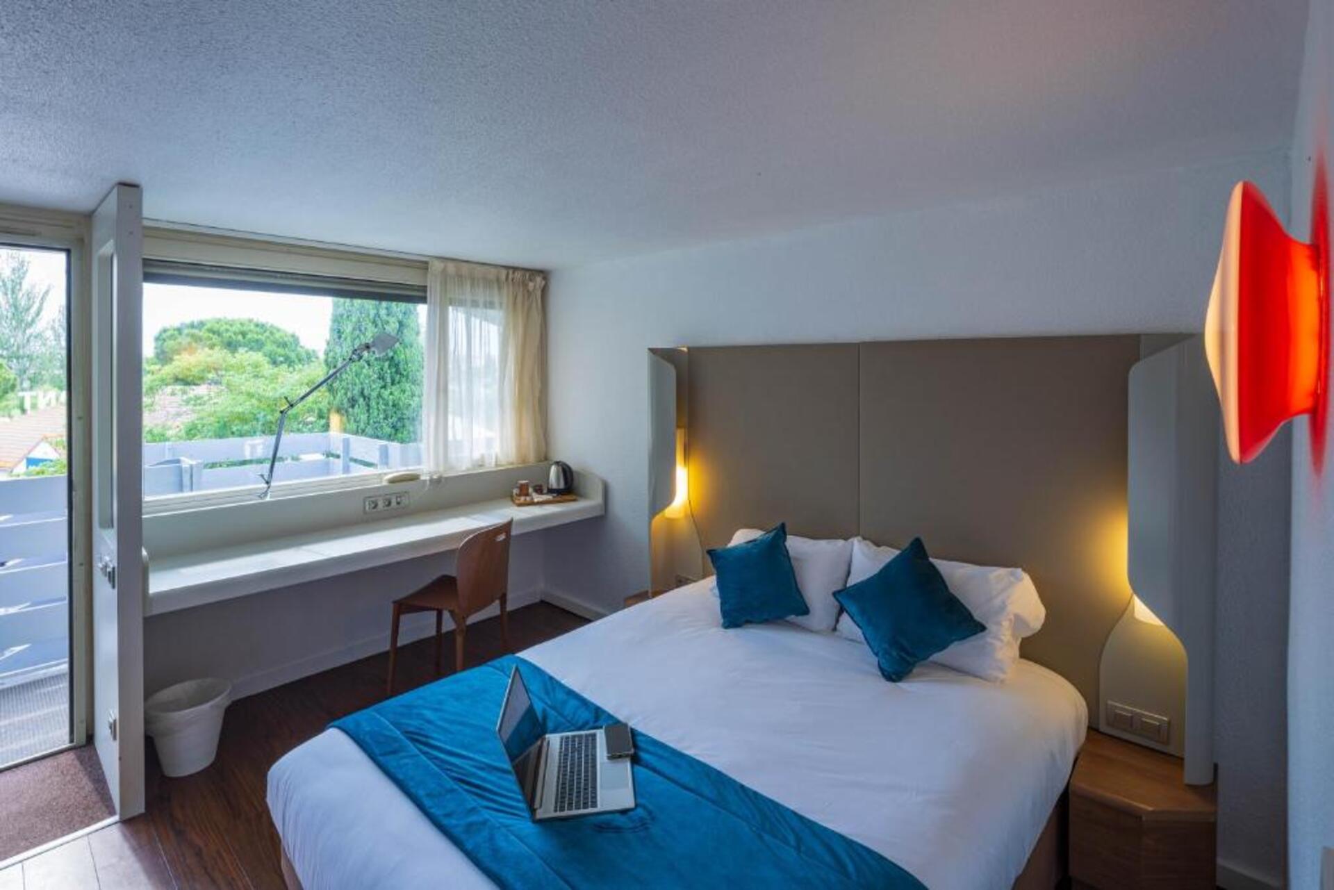 Suite met zithoek — l’Hôtel Noemys Arles