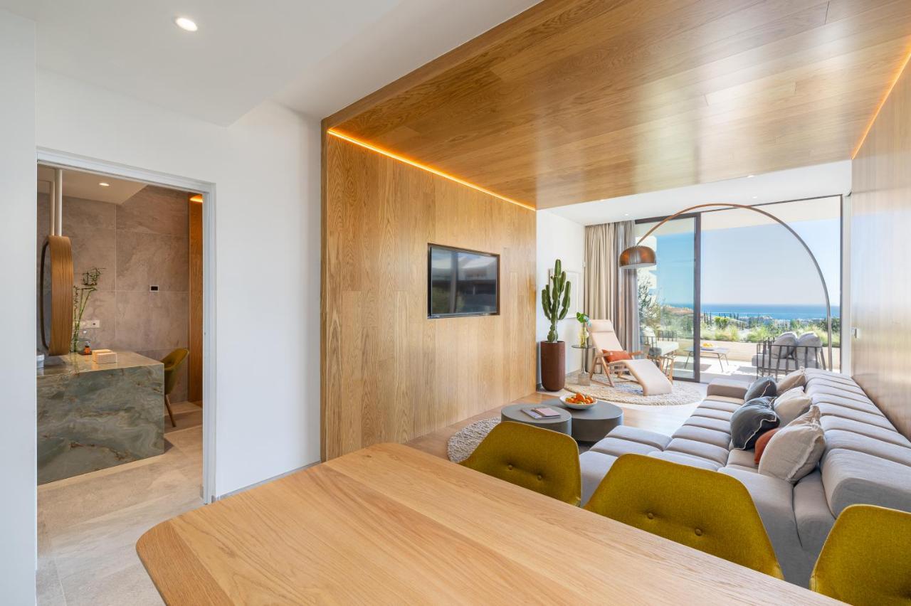 a living room with a couch and a table at Leiro Residences - Preferred Hotels & Resorts in Fuengirola