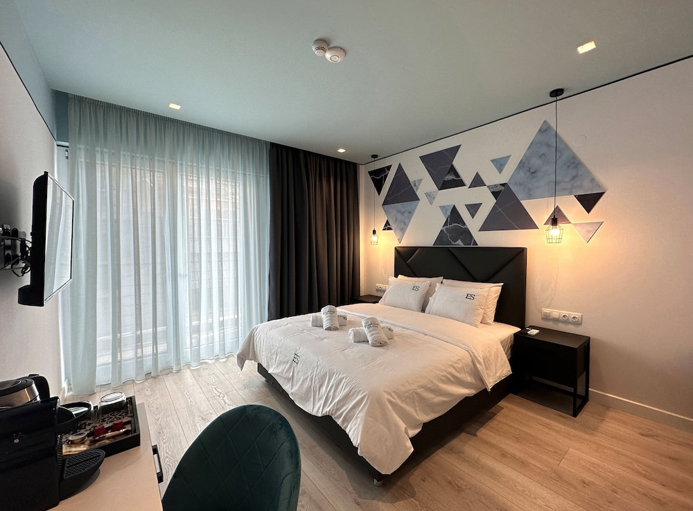 Hotelkamer met premium bedlinnen en styling