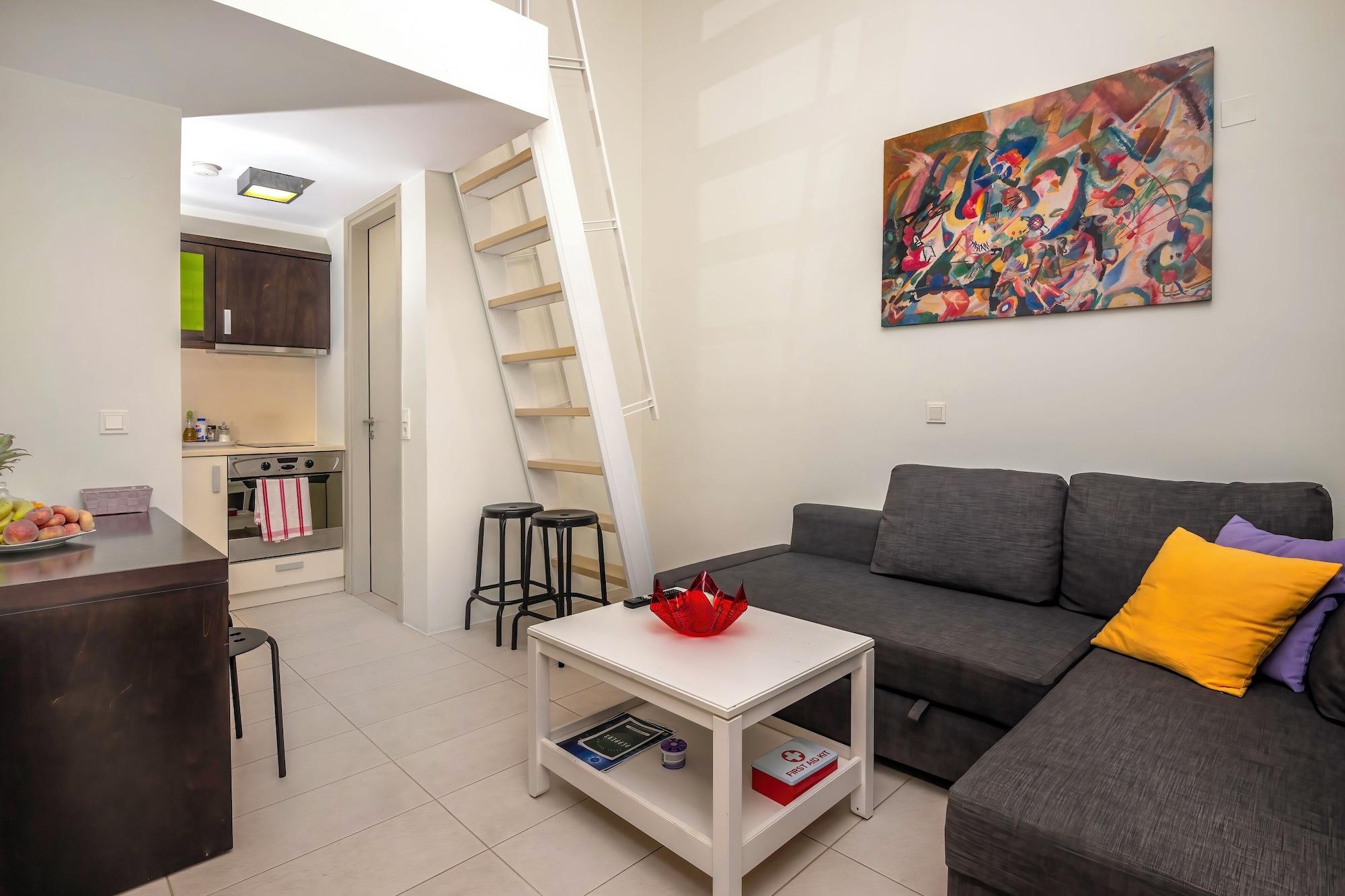 Suite met zithoek — Vivian Art Apartments